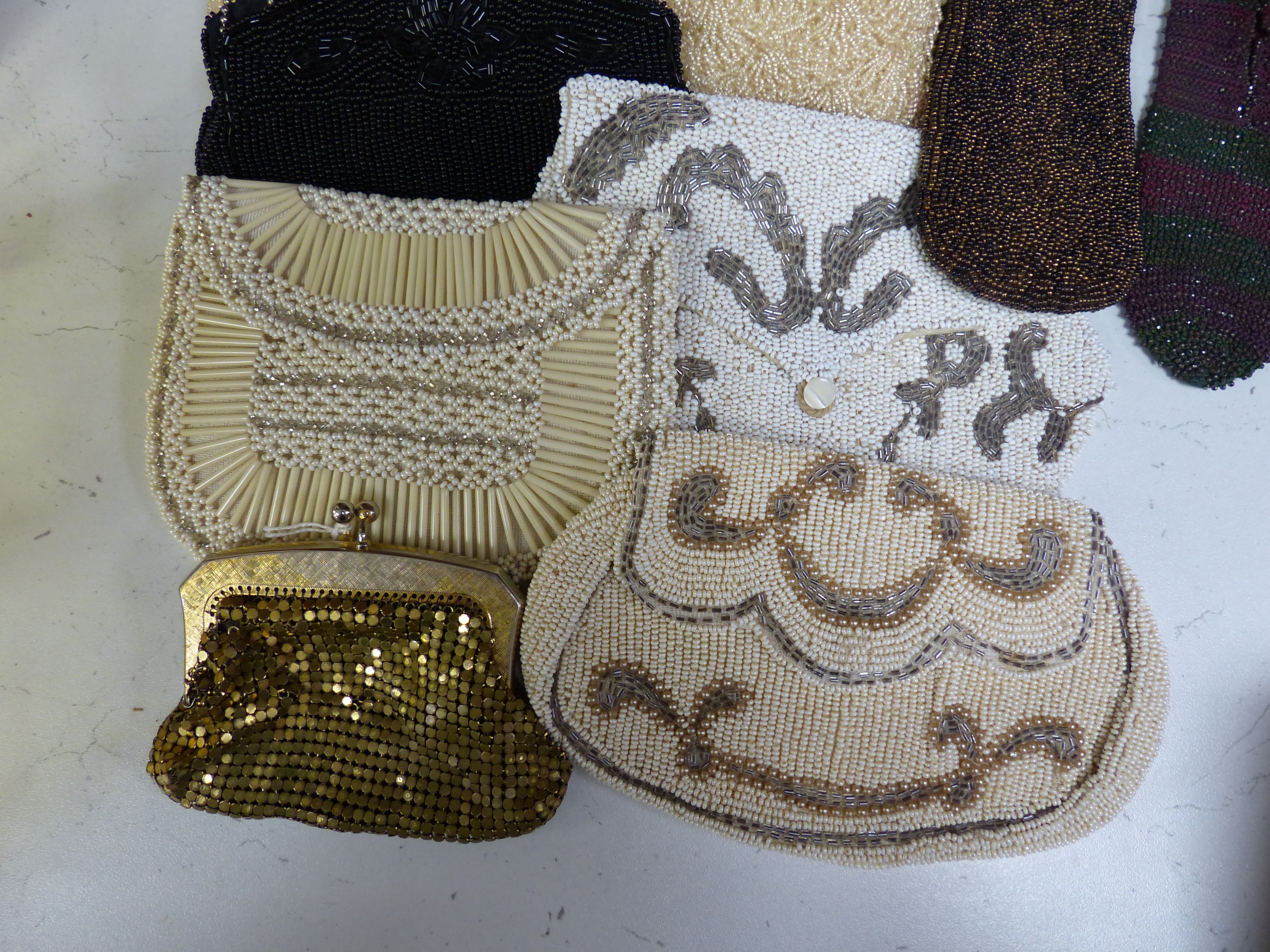 Ten beaded evening bags, a pouch and miser's purse and a metal purse